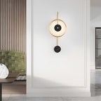 The Clérachic Orphaa on a bright panelled hallway wall, brass and marble reading as quiet jewellery at eye level.