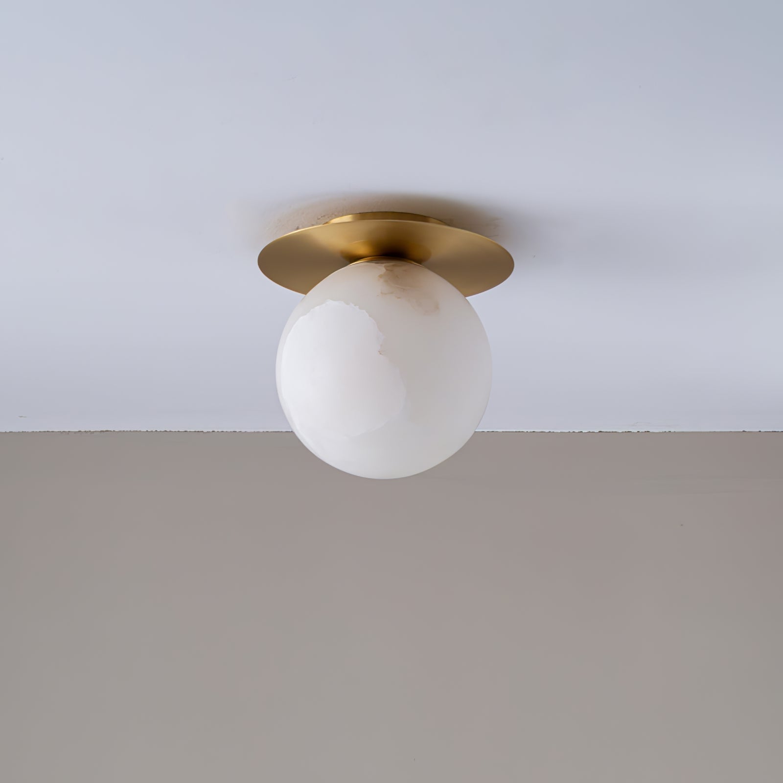 Clérachic Orrila ceiling mount fitted flush to a white ceiling above a pale grey wall.