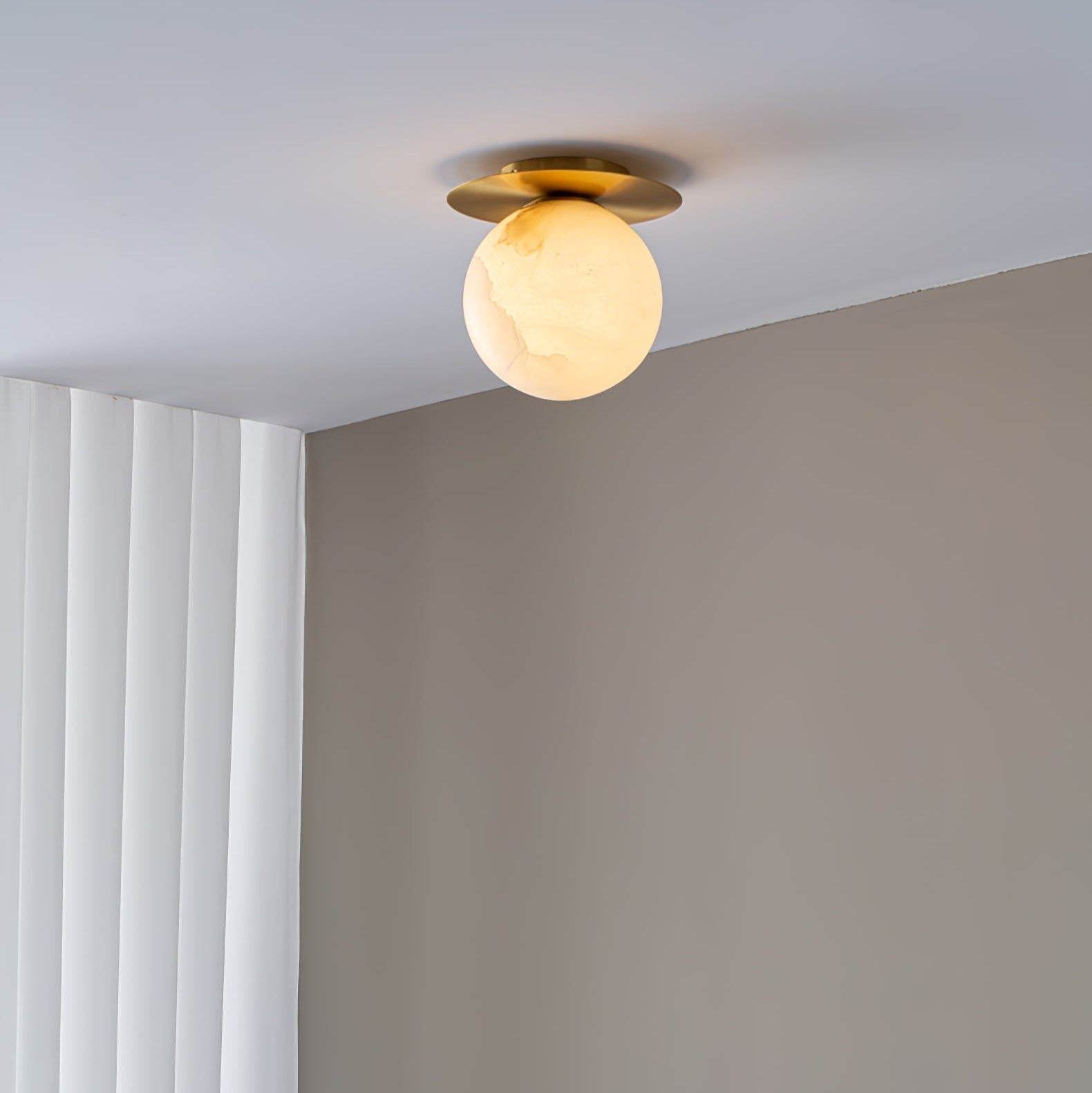 The Clérachic Orrila ceiling mount lit where white panelling meets the ceiling line.