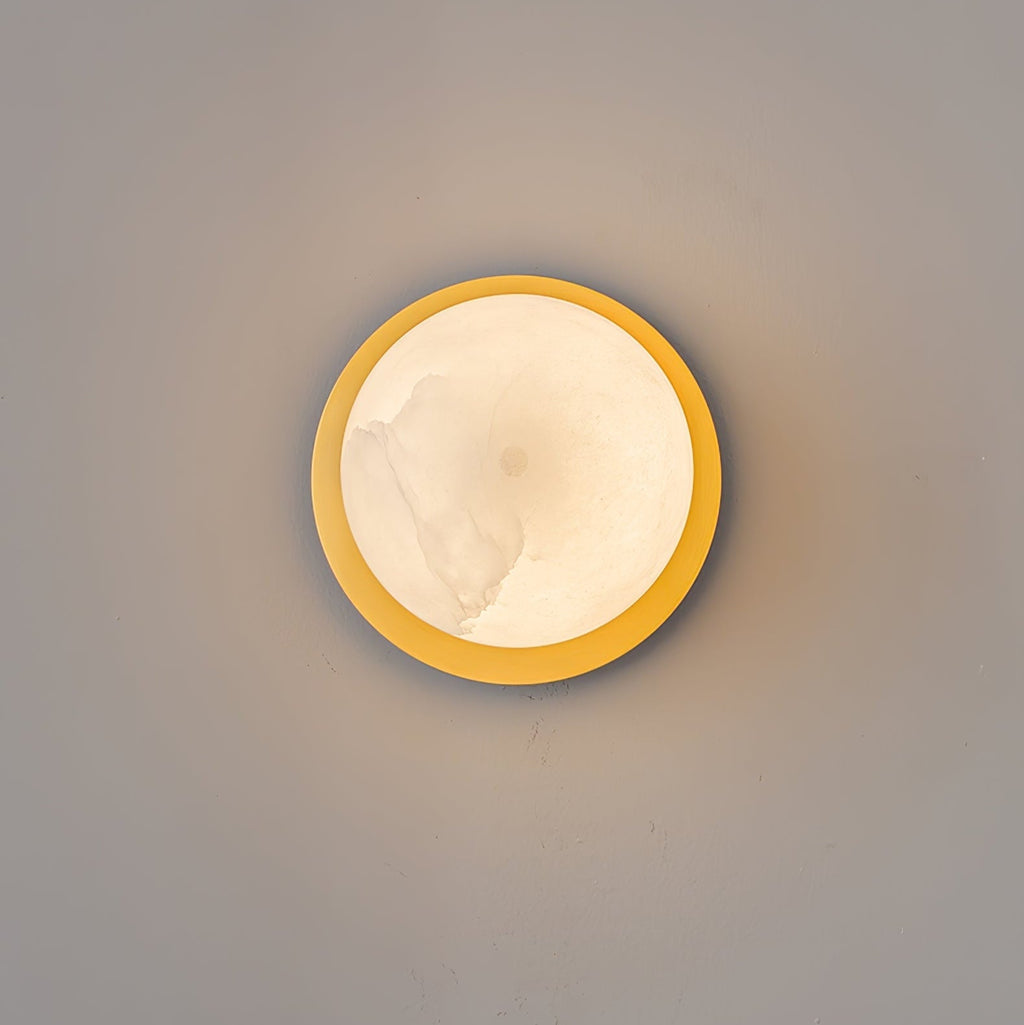 Clérachic Orrila seen straight on, brass ring encircling the lit alabaster face.