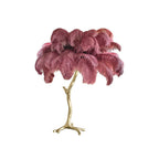 Clérachic table lamp with dusky rose-mauve feathers on a gold branch stem, shown on a plain white background.