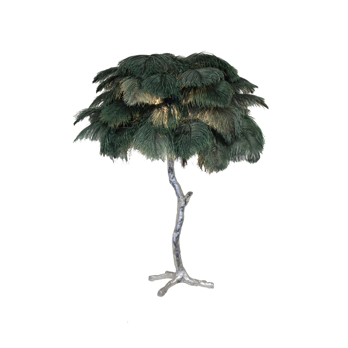 Clérachic table lamp with dark green feathers, lit from within, on a silver branch stem against a white background.