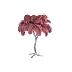Clérachic table lamp with dusky rose-mauve feathers on a silver branch stem, on a white background.