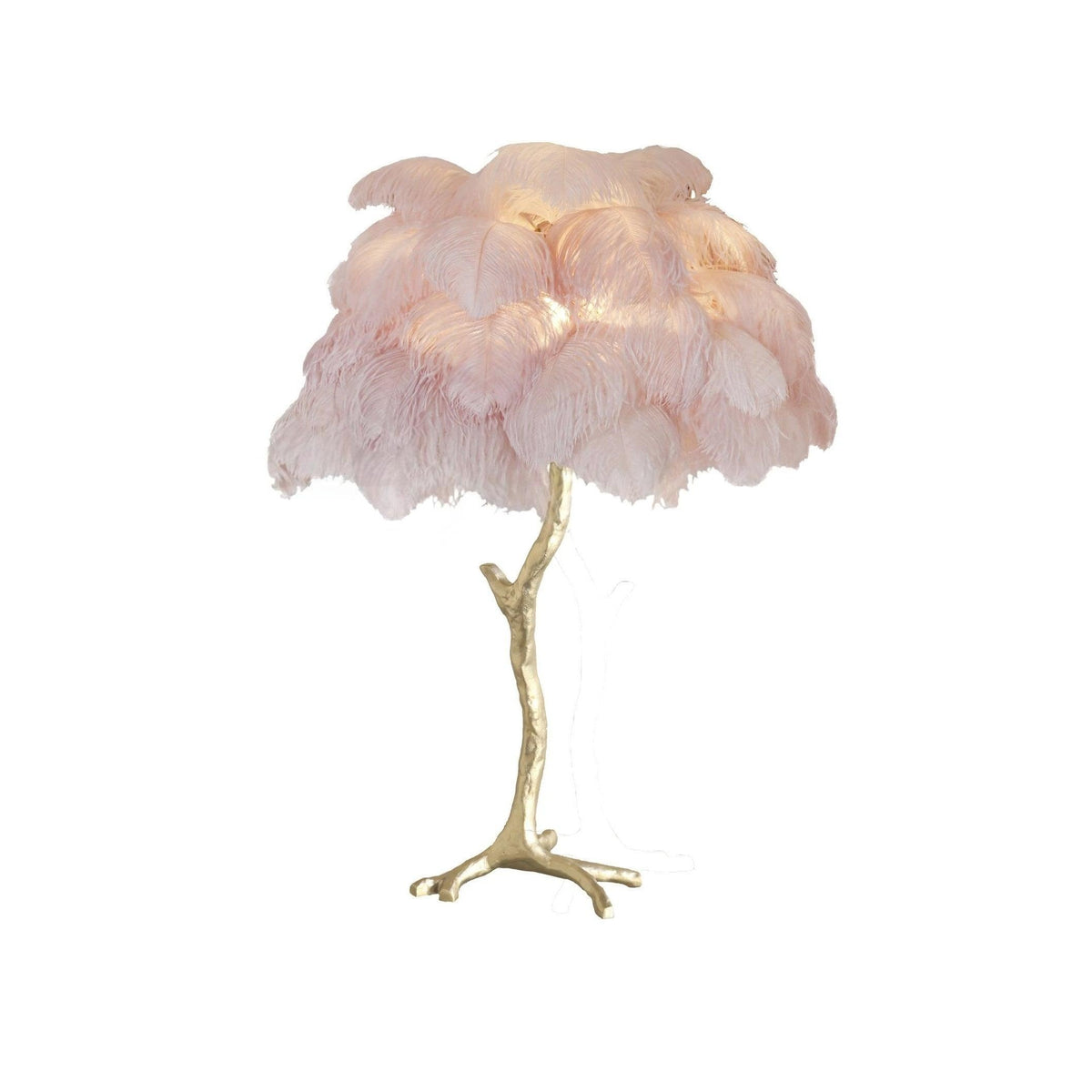 Clérachic table lamp with lit blush-pink feathers on a gold branch stem with splayed feet, on a white background.