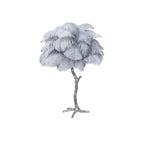 Clérachic table lamp with pale blue-grey feathers on a silver branch stem, shown on a white background.