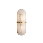 Clérachic alabaster sconce on white, showing the rounded pill silhouette and the brass band wrapping its waist.