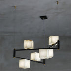 Clérachic box chandelier in the six-light size, its alabaster cubes lit warm across two staggered tiers.