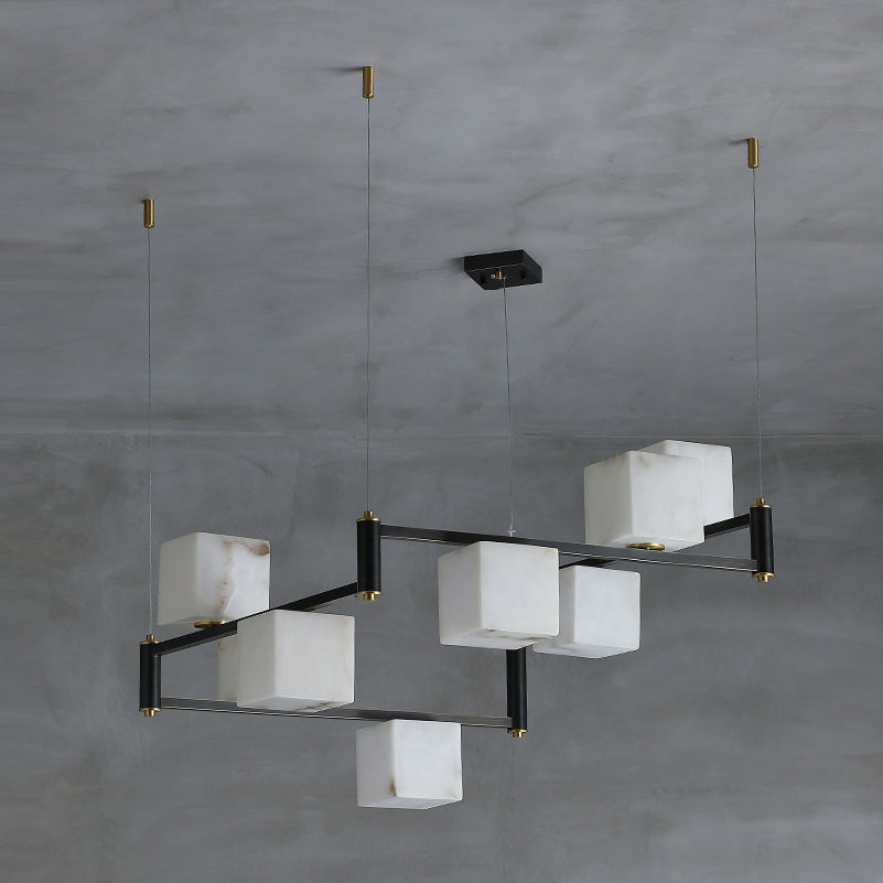 Clérachic eight-light chandelier viewed on the diagonal, the stepped arms clearly offset from one another.