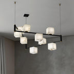 The Clérachic Ostruvye lit at its full nine-light spread beside a floor-length curtain and pale plaster wall.