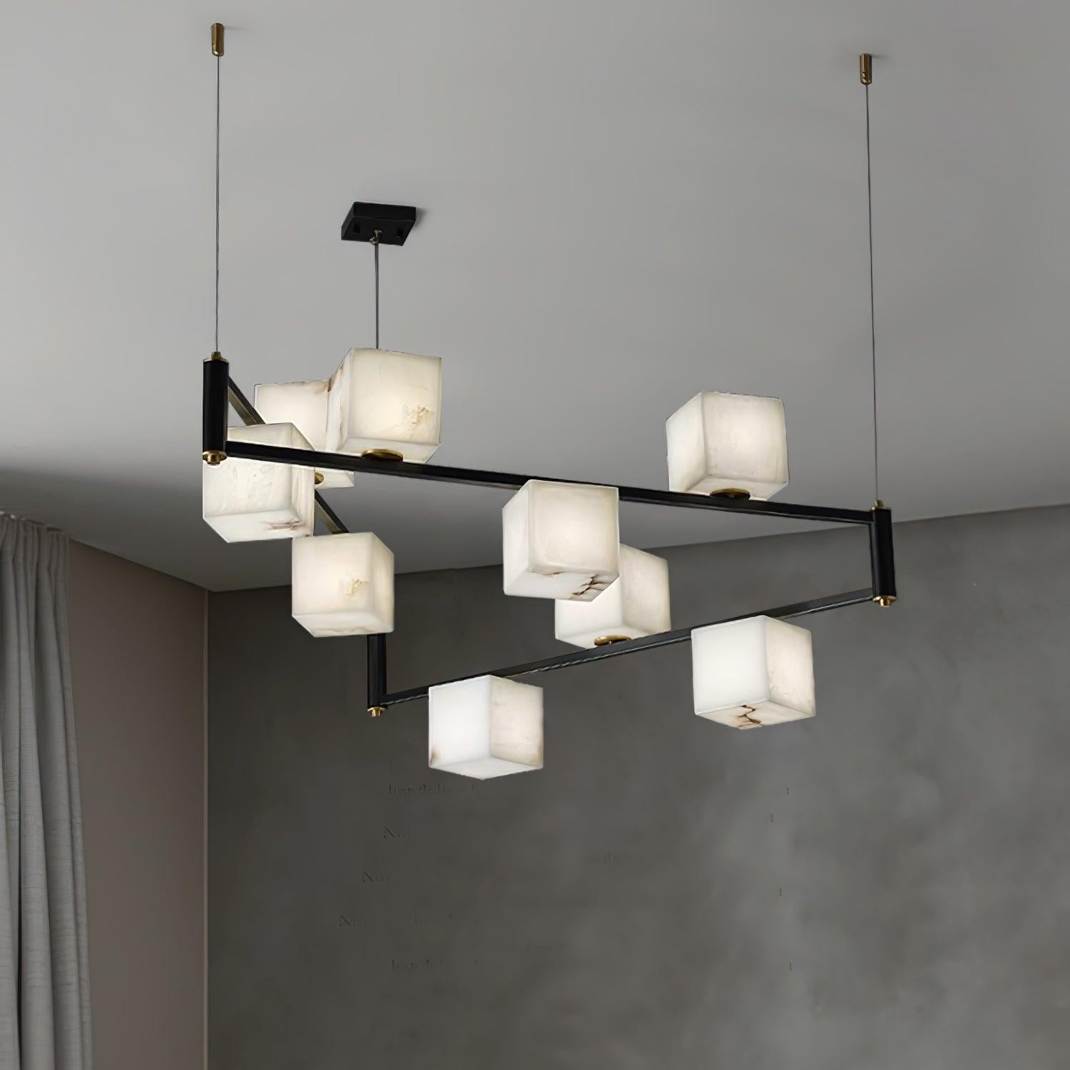 The Clérachic Ostruvye lit at its full nine-light spread beside a floor-length curtain and pale plaster wall.
