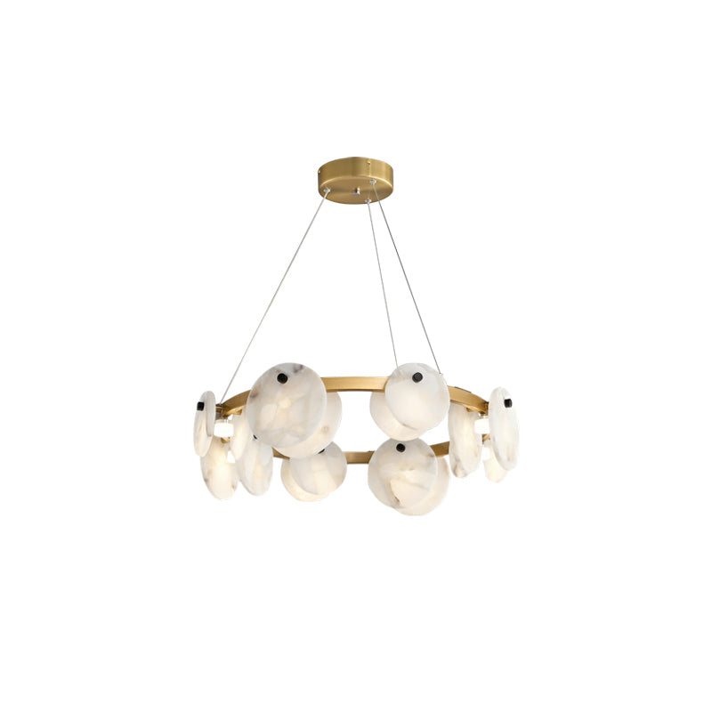 Clérachic brass hoop chandelier with hand-cut alabaster discs and opal orbs, shown three-quarter on a white ground.