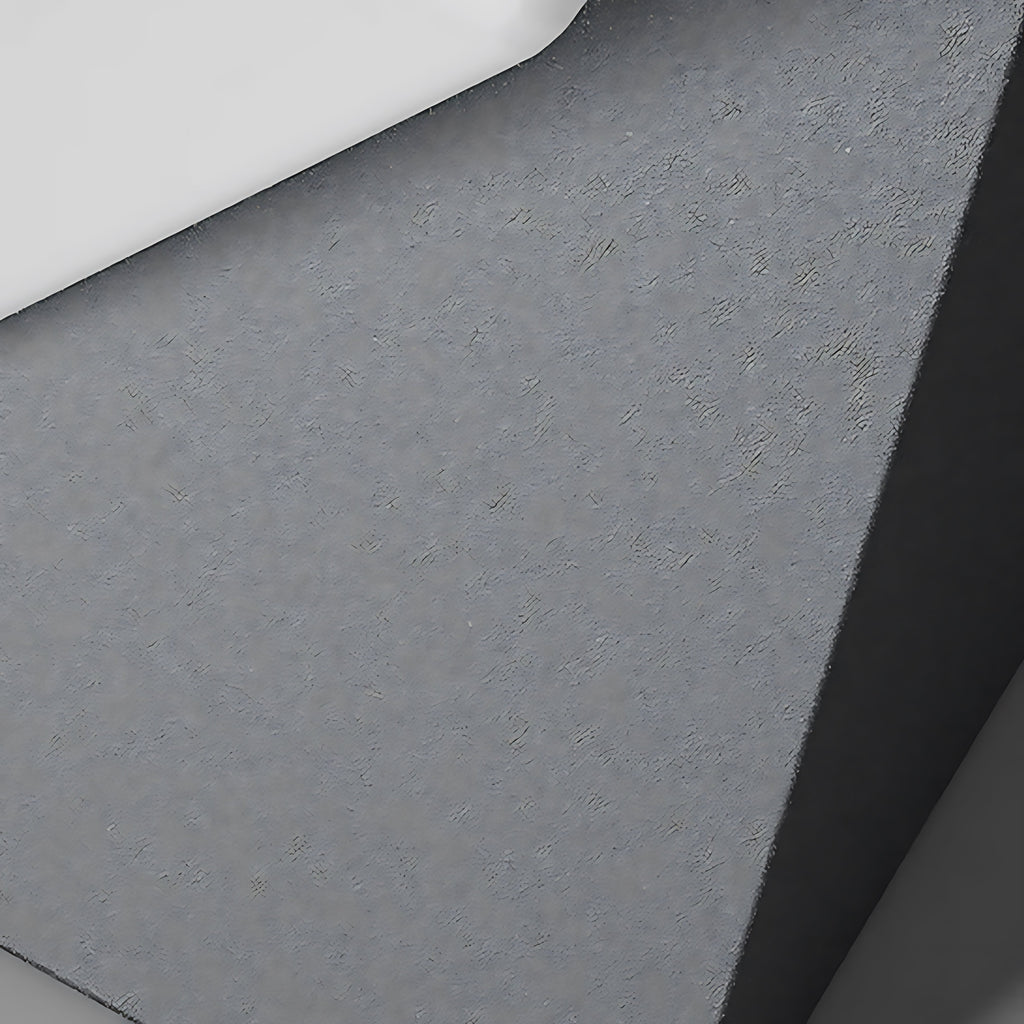 Clérachic outdoor pillar light, detail of the sprayed grey surface, its even grain broken only by the sharp fold between two facing panels.
