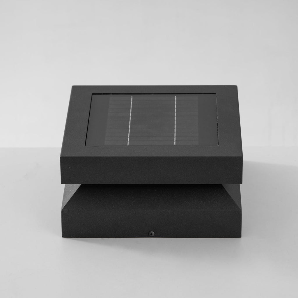 Front view of a Clérachic square post light on pale grey, showing the framed solar lid above the base.