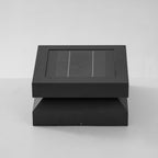 Front view of a Clérachic square post light on pale grey, showing the framed solar lid above the base.