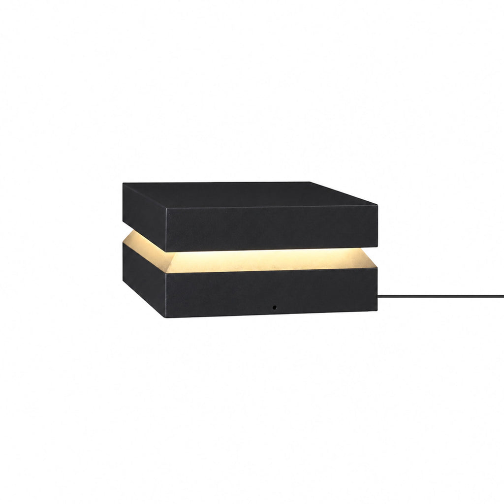 Mid-sized black Clérachic post light on white, with a warm band and a cable leaving the base.
