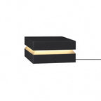 Mid-sized black Clérachic post light on white, with a warm band and a cable leaving the base.