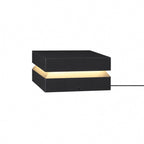 Larger black Clérachic post light on white, with its cable running out to the right.