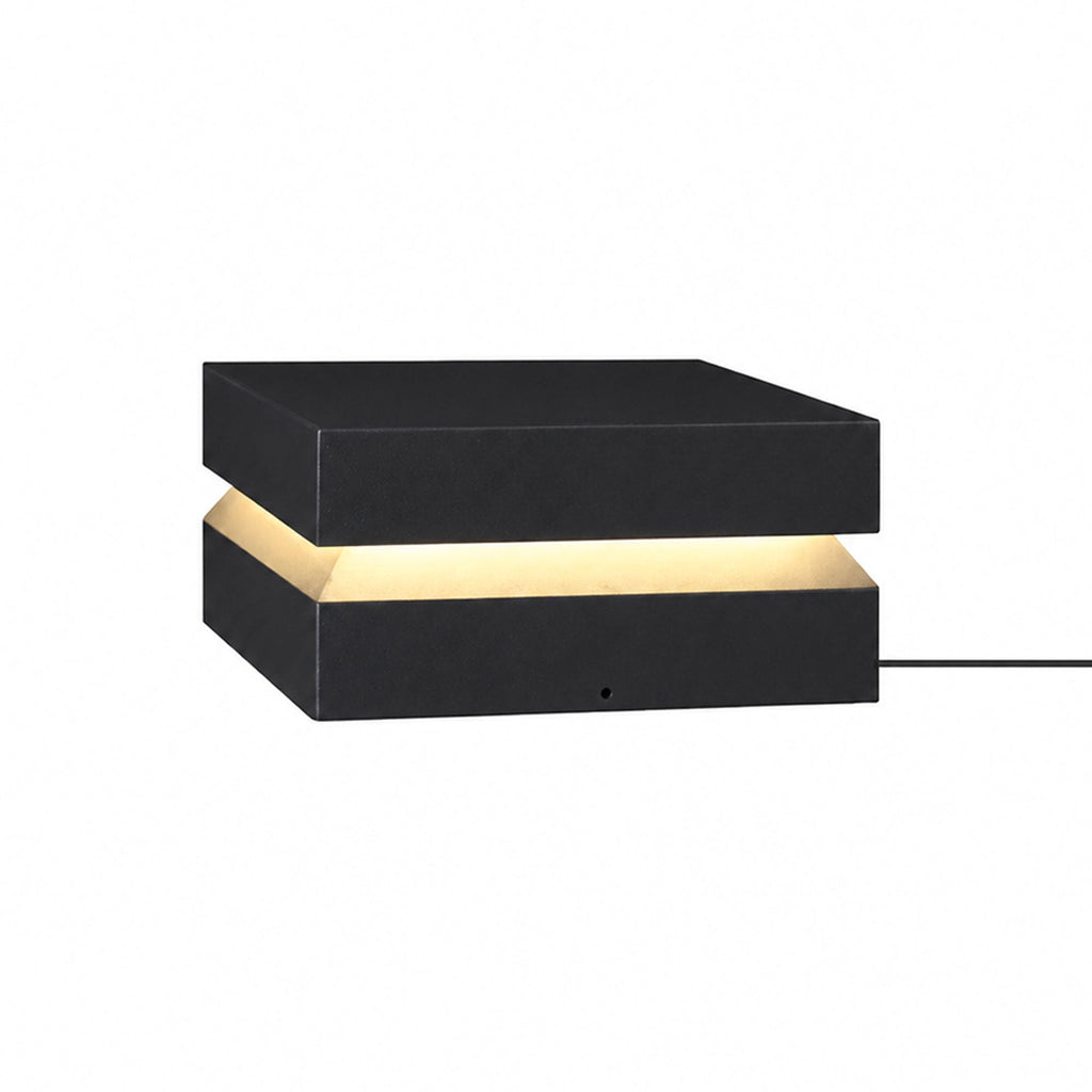 Largest black Clérachic post light on white, with a wide warm band and a cable on the right.