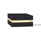 Largest black Clérachic post light on white, with a wide warm band and a cable on the right.