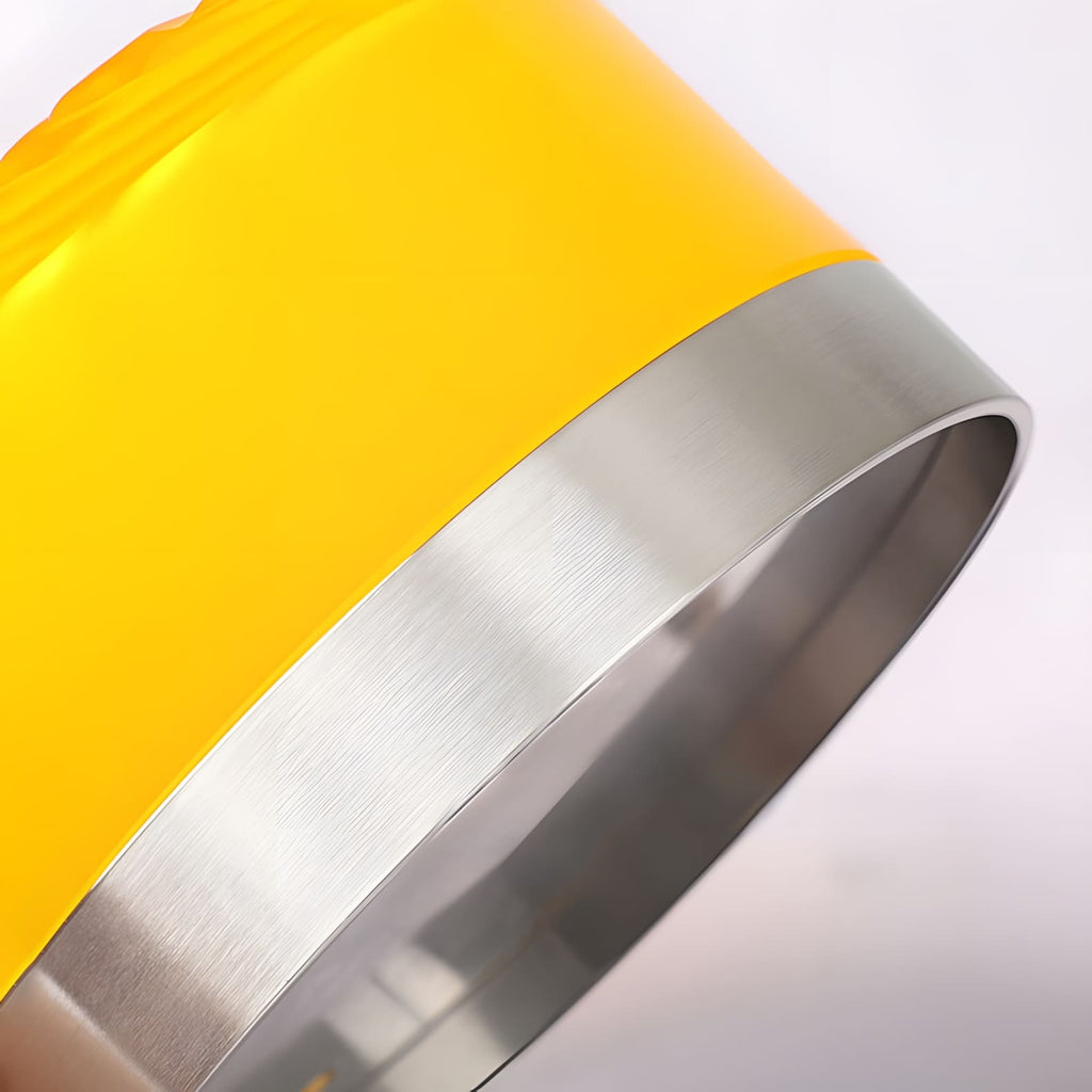 Close view of the brushed steel rim at the edge of this Clérachic wall light's yellow glass shade.