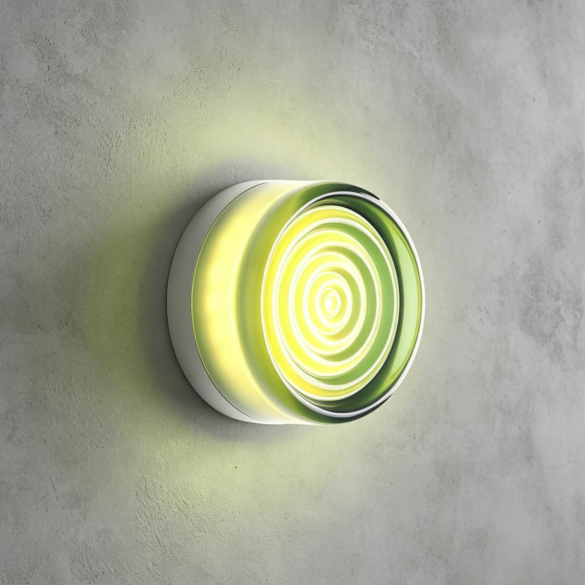 Pale green rippled-glass Clérachic wall light glowing lime against a grey concrete wall, a faint green halo around it.
