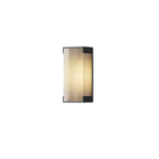 Small ribbed-panel wall light from Clérachic with black end caps, shown on a plain white background.