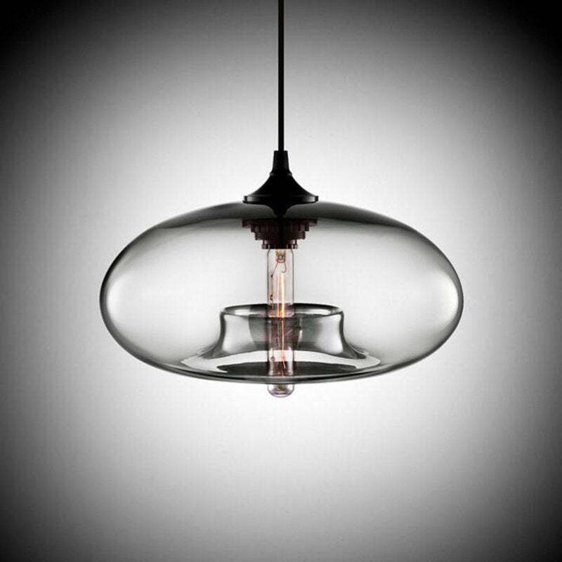 Studio shot of the Clérachic oval pendant light in clear glass, the bulb appearing to float on its ring of glass.
