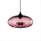 Rose-tinted Clérachic oval blown glass pendant light on white, the inner glass collar visible through the shade.