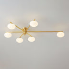 Clérachic Oval Opal Glass Ceiling Light in brass with six shades, one arm reaching far right across a wide ceiling.
