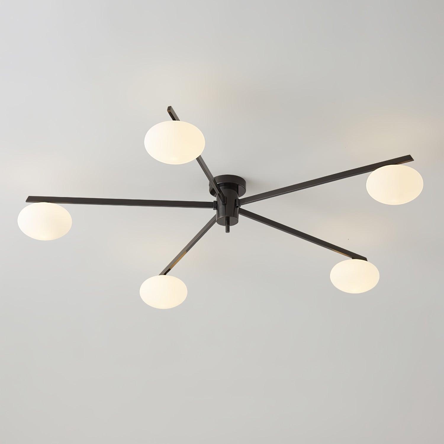 Clérachic Oval Opal Glass Ceiling Light in black with five oval shades splayed on long blades over a grey ceiling.