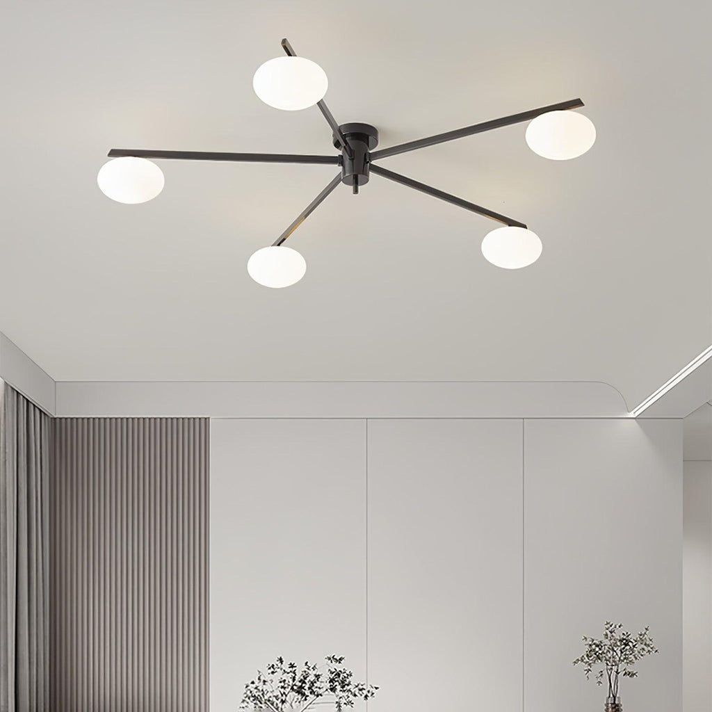 Clérachic Oval Opal Glass Ceiling Light in black over a living room with ribbed curtains and pale cabinetry.