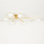 Clérachic Oval Opal Glass Ceiling Light in brass photographed head-on, six ovals sitting low beneath flat blades.