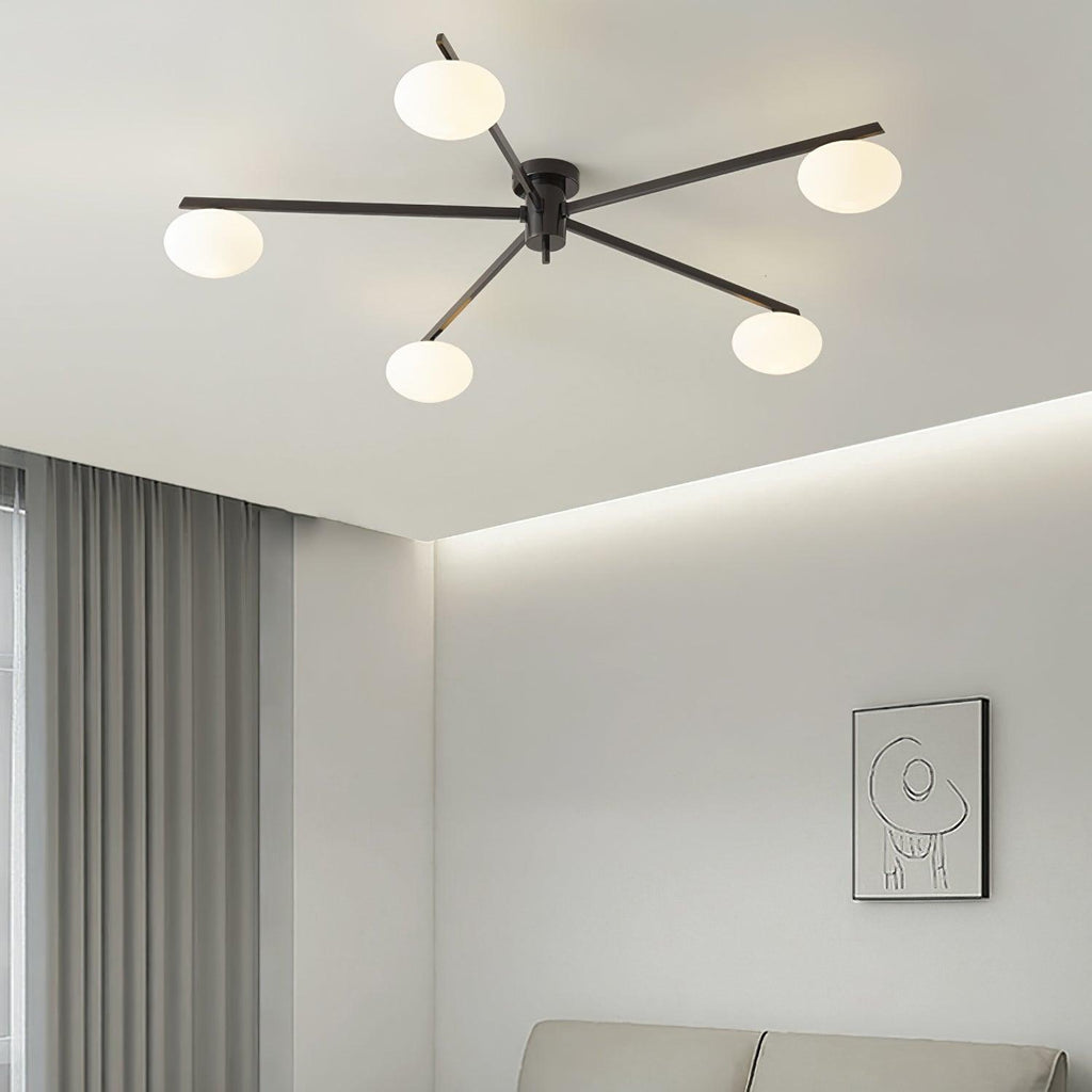 Clérachic Oval Opal Glass Ceiling Light in black lighting a living room with cove lighting and a framed sketch.