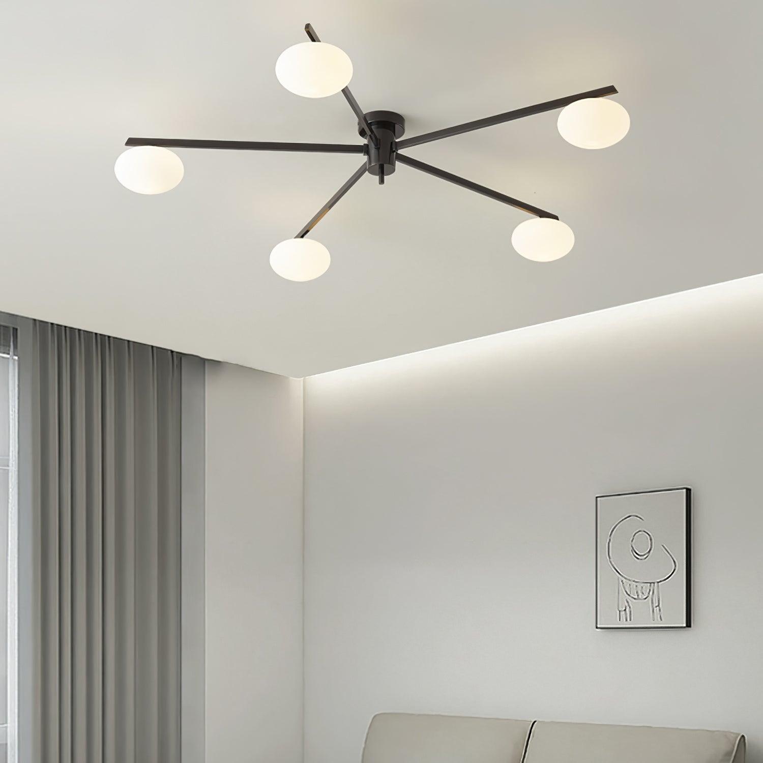Clérachic Oval Opal Glass Ceiling Light in black lighting a living room with cove lighting and a framed sketch.