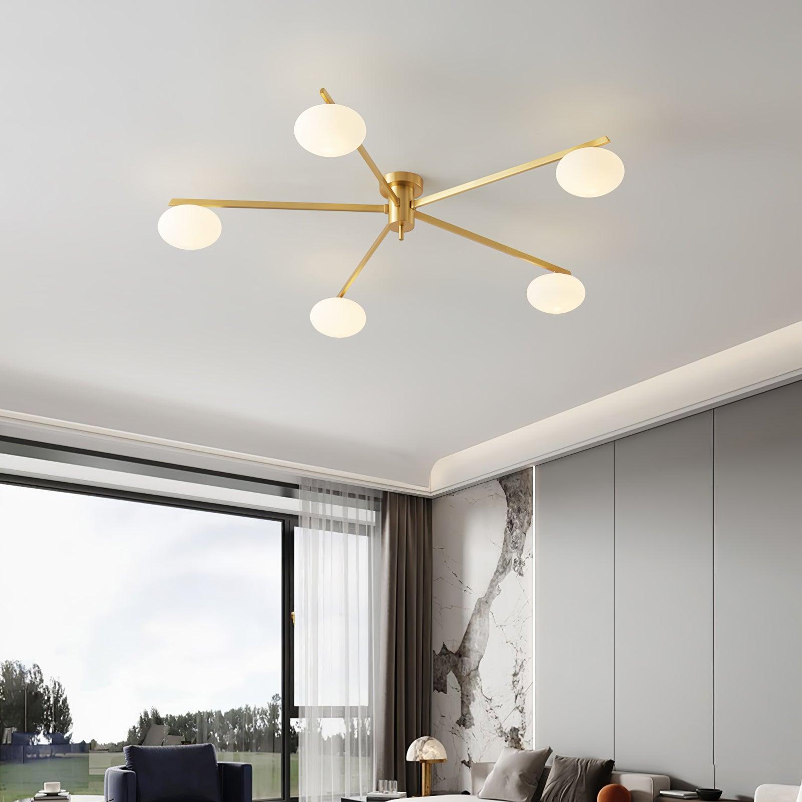 Clérachic Oval Opal Glass Ceiling Light in brass over a bright living room with floor-to-ceiling glazing.