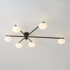 Clérachic Oval Opal Glass Ceiling Light in black, six ovals stepped across the blades at a shallow angle.