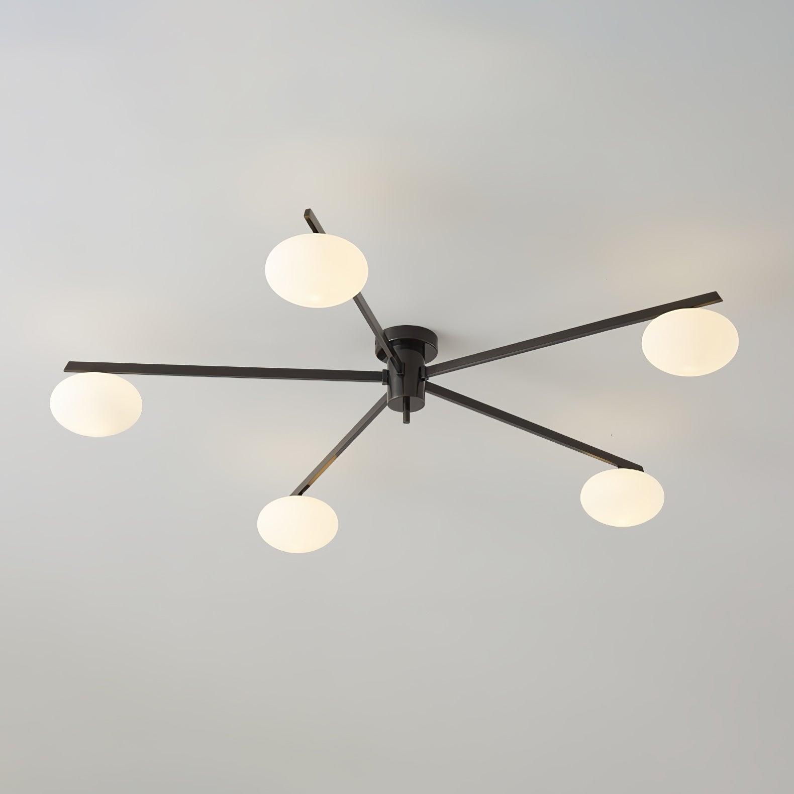 Clérachic Oval Opal Glass Ceiling Light in black with five shades, arms crossing over a plain grey ceiling.