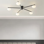 Clérachic Oval Opal Glass Ceiling Light in black mounted flush to a coved ceiling above a panelled headboard.