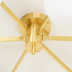 Canopy close-up of the Clérachic Oval Opal Glass Ceiling Light in brass, six flat arms slotting into the base.