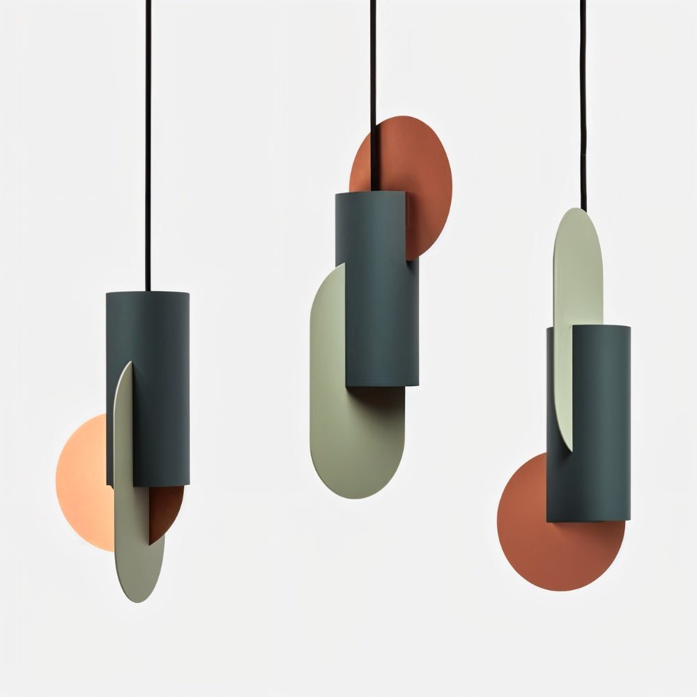 Clérachic three teal cylinder pendants, each with a sage oval and a terracotta or peach disc set in a different arrangement.