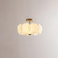 The Clérachic overlapping glass disc semi-flush ceiling light with gold hardware, unlit against a plain grey backdrop.