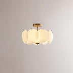 The Clérachic overlapping glass disc semi-flush ceiling light with gold hardware, unlit against a plain grey backdrop.