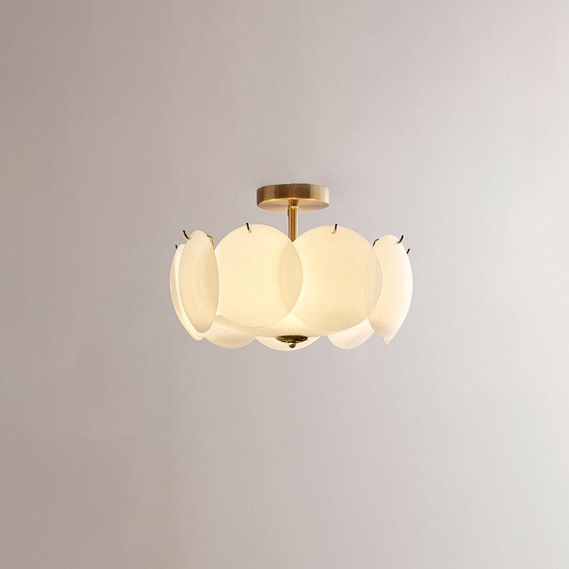 The Clérachic overlapping glass disc semi-flush ceiling light with gold hardware, unlit against a plain grey backdrop.