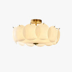 Another studio angle of the lit Clérachic overlapping glass disc semi-flush ceiling light with its gold ceiling mount.