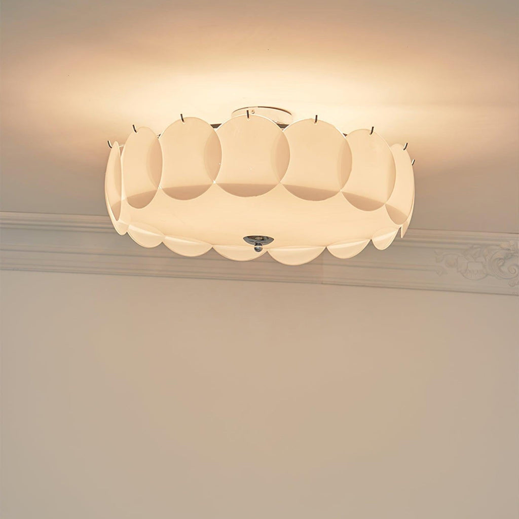 Close studio view of the unlit Clérachic overlapping glass disc semi-flush ceiling light showing its layered glass discs.