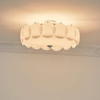 Close studio view of the unlit Clérachic overlapping glass disc semi-flush ceiling light showing its layered glass discs.