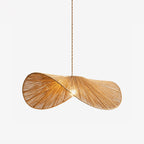 Studio view of this Clérachic pendant's two-lobed paper cord shade, twisted like a wrapped sash.