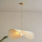 Full-drop studio shot of this Clérachic pendant, its twisted cord dropping from a round wood canopy.