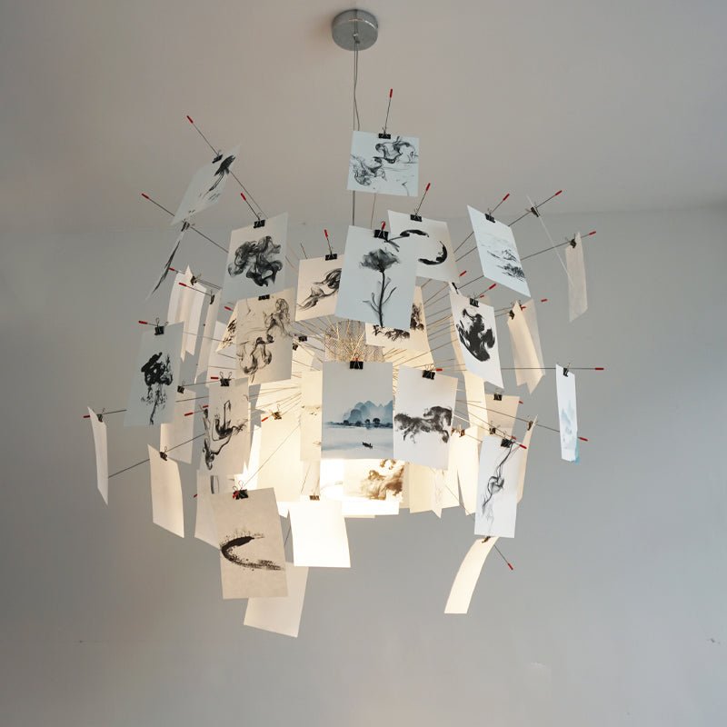 Cards with brush-ink paintings cling to this lit Clérachic paper pendant, whose red-tipped wire arms fan out beneath a ceiling rose.