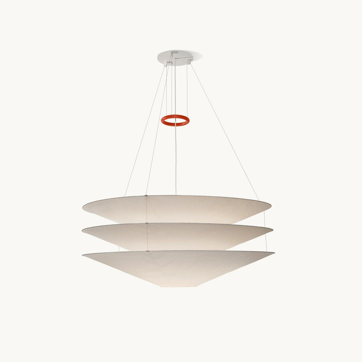 This Clérachic pendant has three stacked white paper cones hung on fine cables, with a red ring above, on a plain white backdrop.